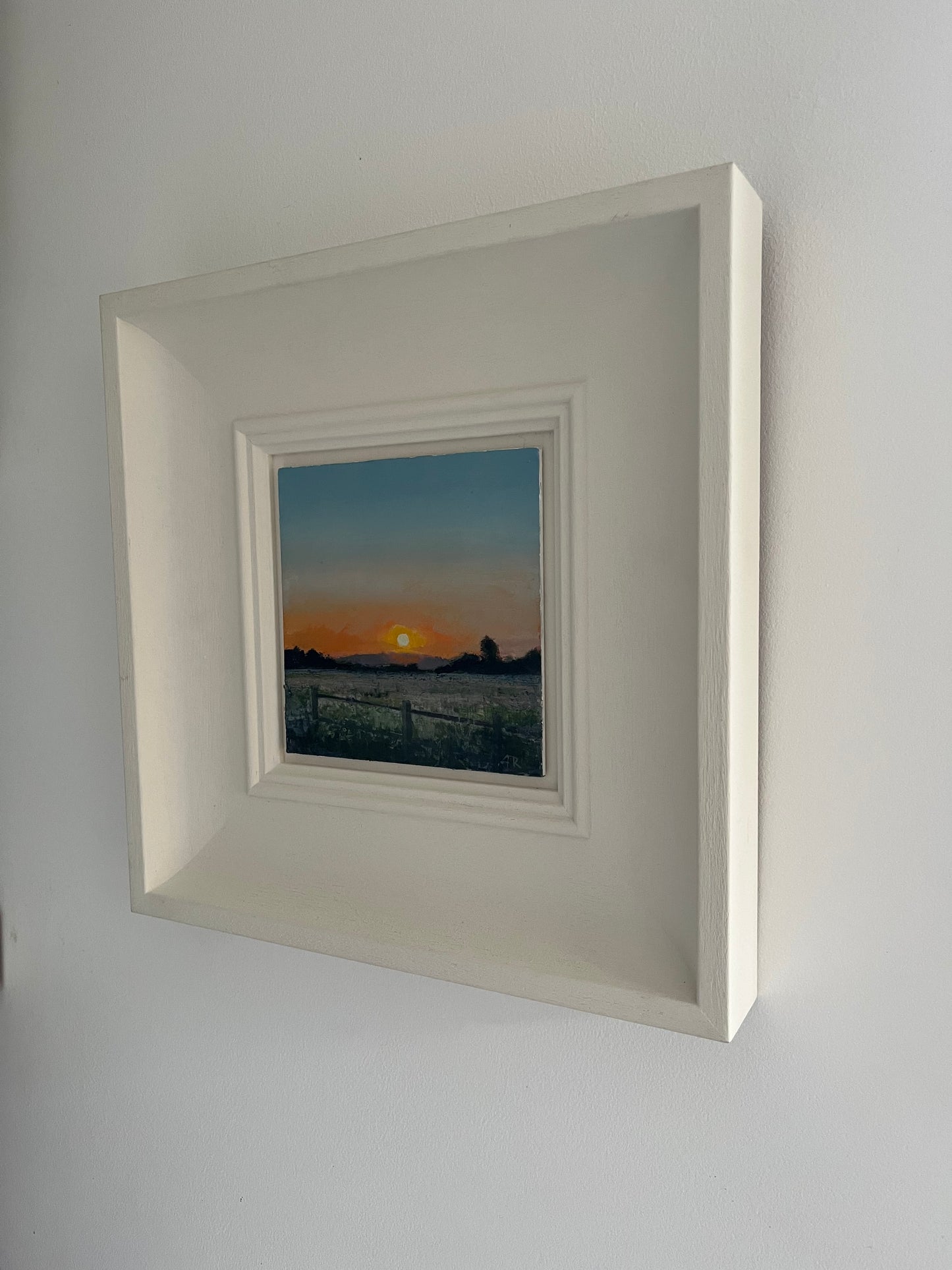 Fenced in field at sundown