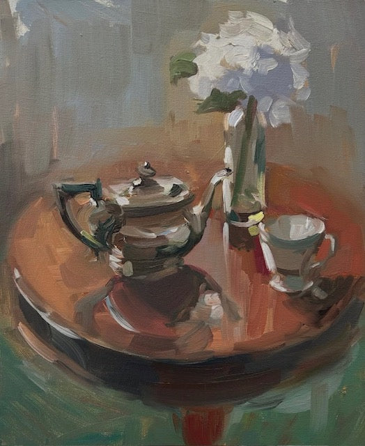 An oil painting still life depicting a silver teapot, a white teacup, and white flowers in a glass vase on a round wooden table, rendered in warm earthy tones with visible brushstrokes.
