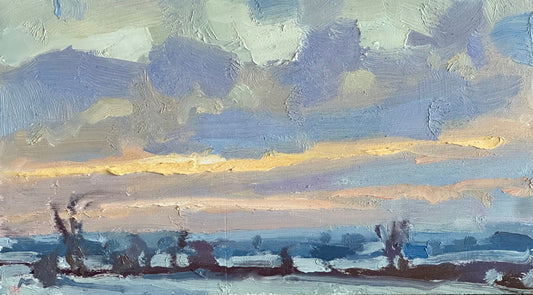 Pale yellow skies and snow